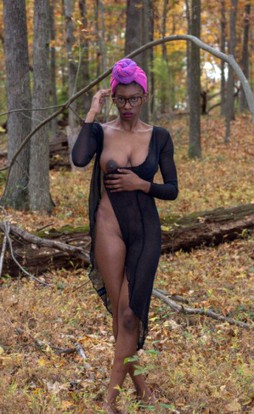 Tall ebony model with big nipples posing